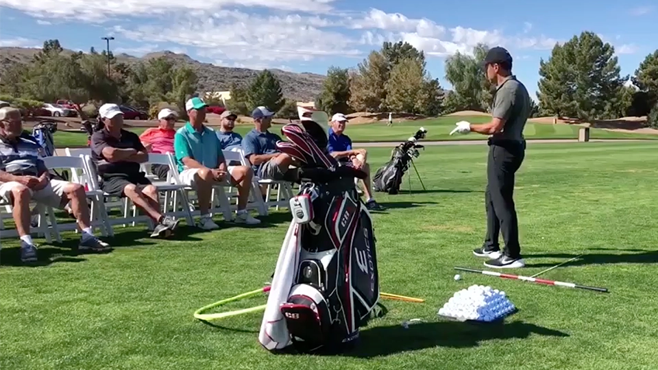 Golfer instructing other golfers