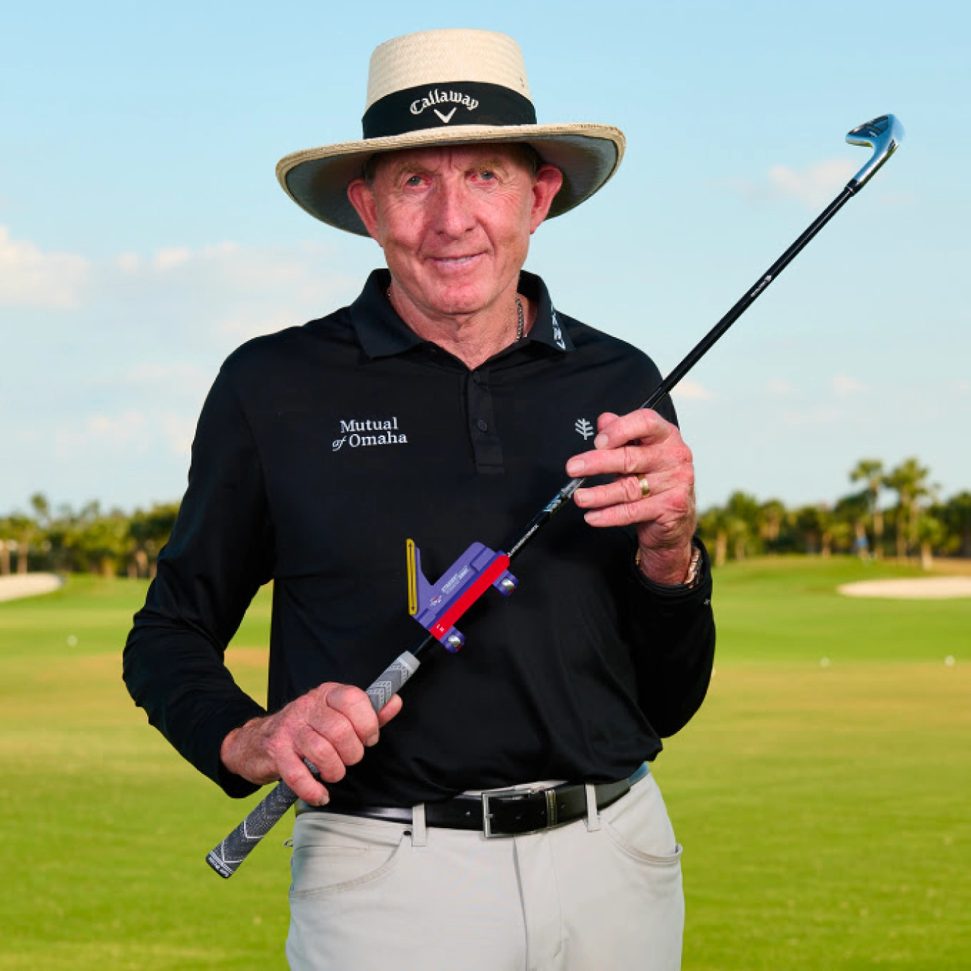 David Leadbetter holding the StraightAway attached to a club