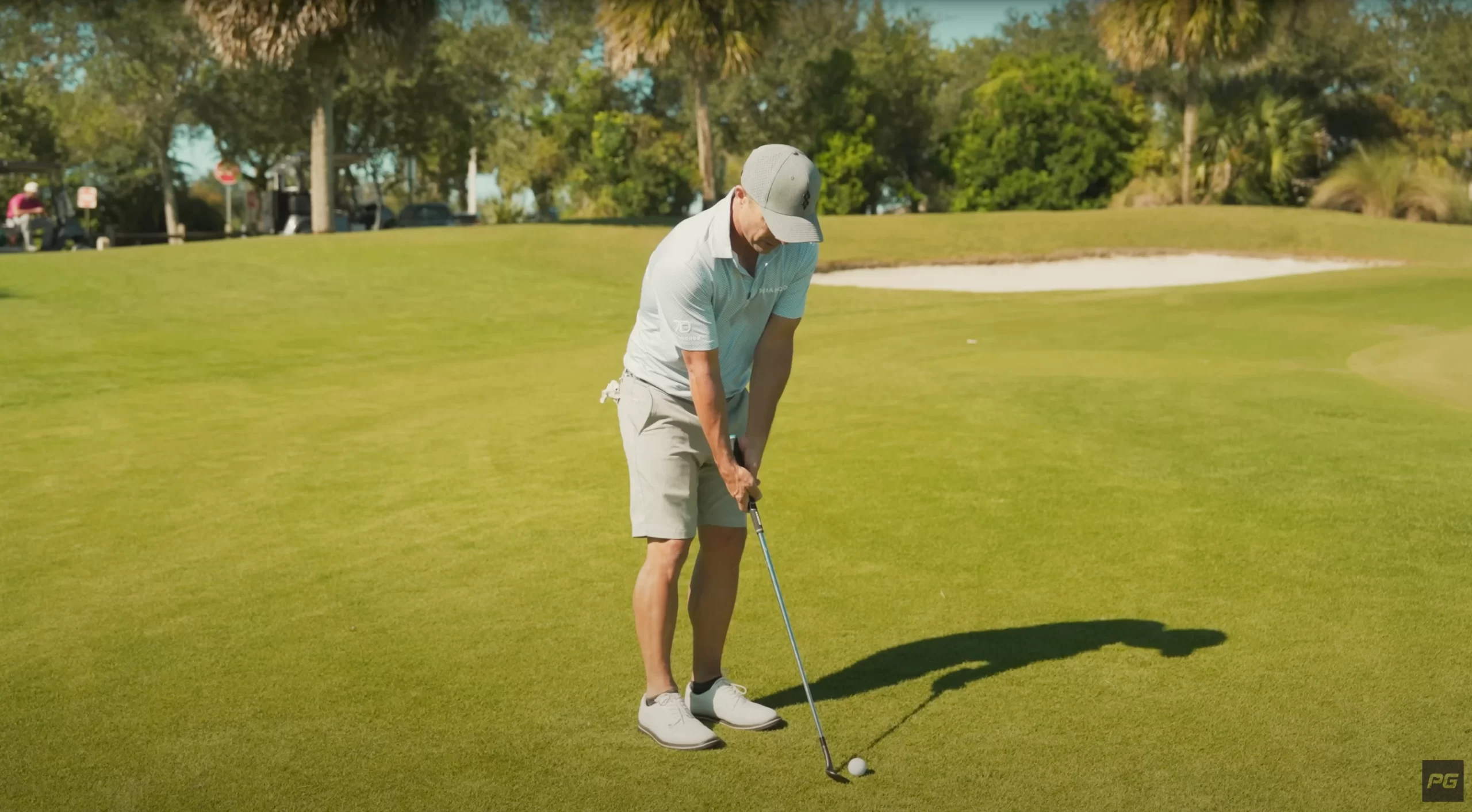 Golfer teeing up a shot