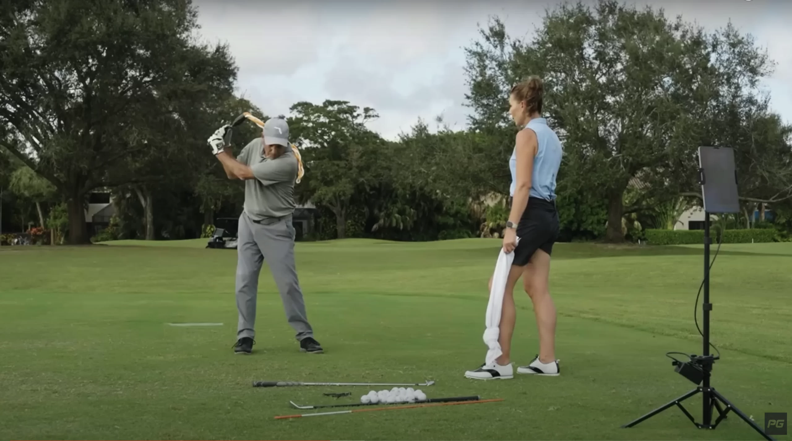 Performance Golf coach Erika Larkin providing a life lesson on the golf course utilizing the rope drill to improve golf swing tempo.