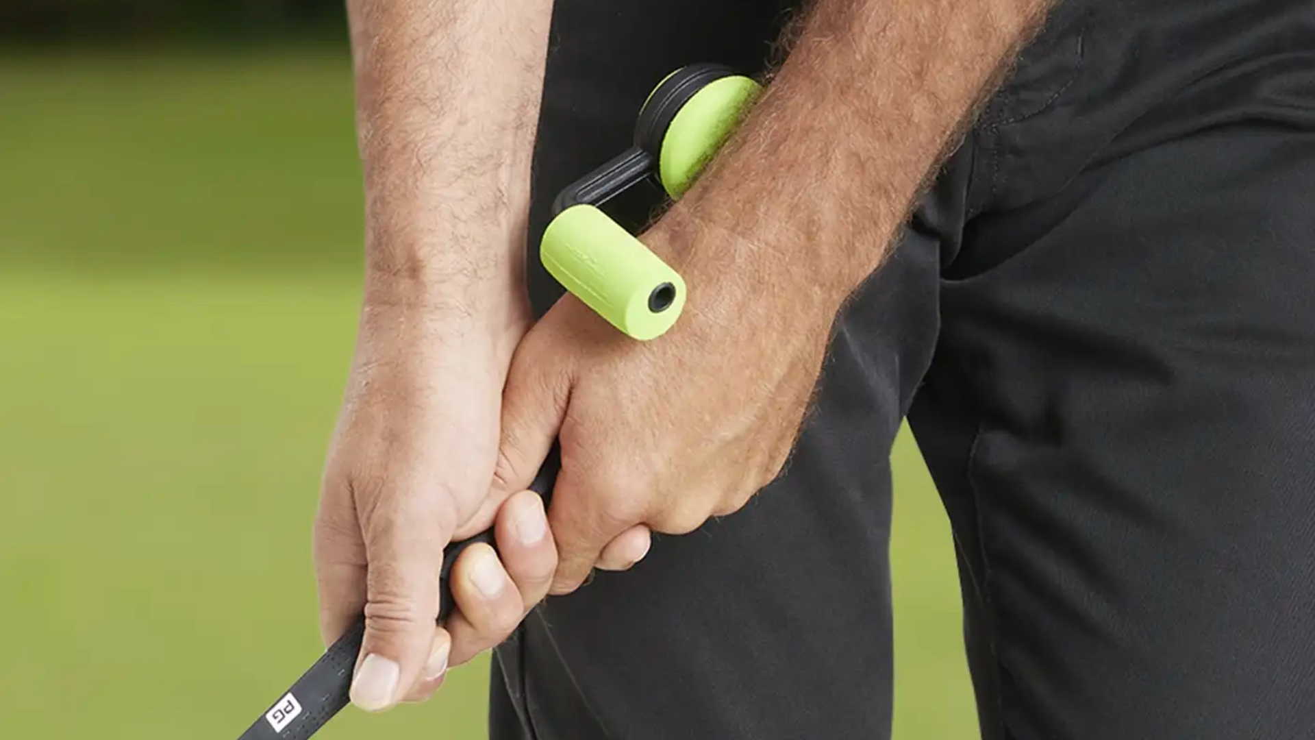 The Performance Golf training aid The SquareSet, in use by a golfer holding a club.