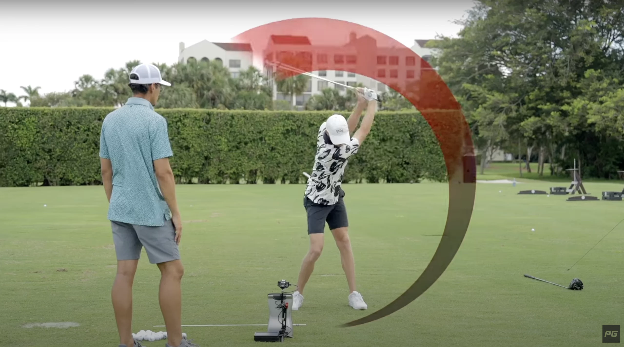 Performance Golf coaches working on a ball speed drill on the golf course, showing an emphasis on the golf swing.