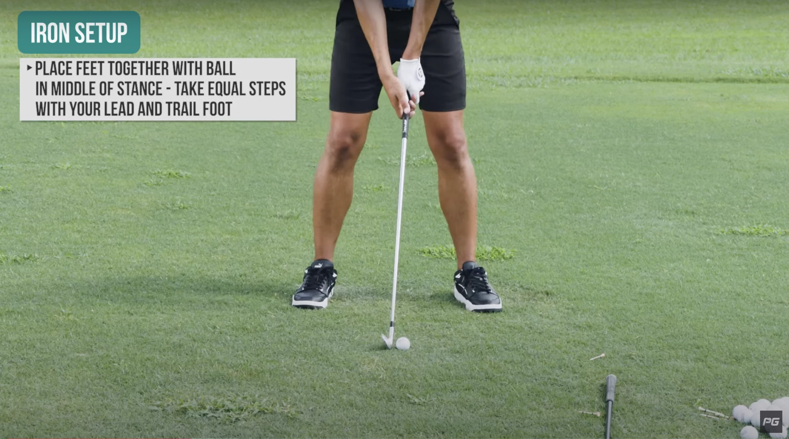 JT Thomas in a Performance Golf YouTube video showcasing a close up of the proper iron setup, including the proper placement of the golf ball and feet.