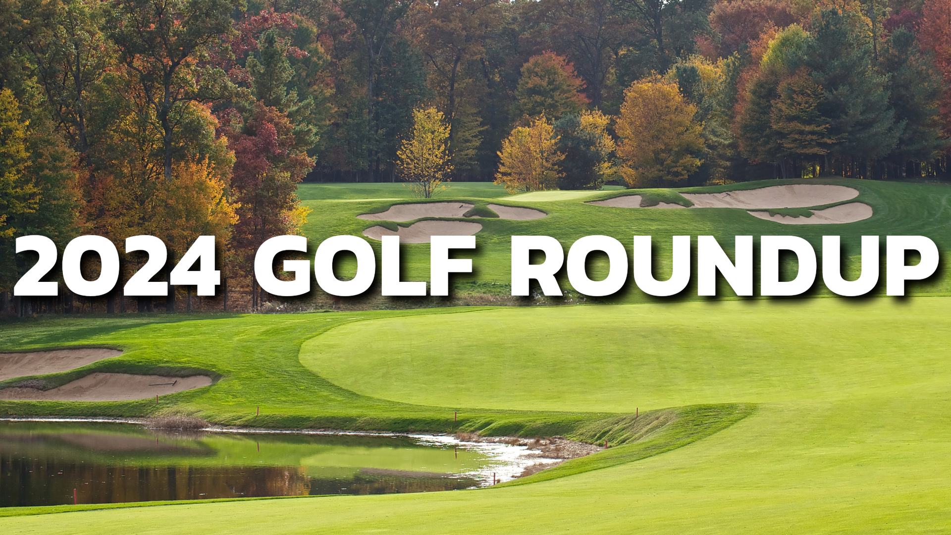 A golf course during the fall with autumn trees and various ponds and sand traps.