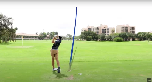 Performance Golf coach JT Thomas hitting a straight drive with accurate contact on the golf course.