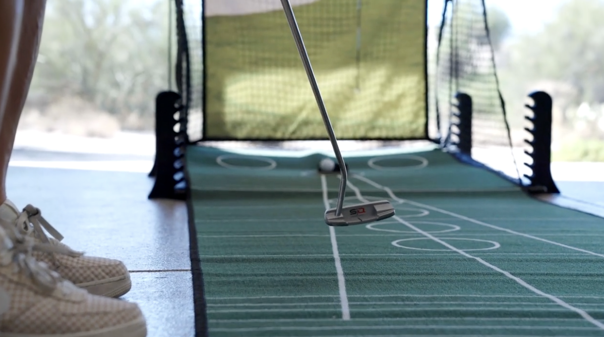 Golfer using the Picture Perfect Chip & Putt golf training aid with the Performance Golf SQ Putter.