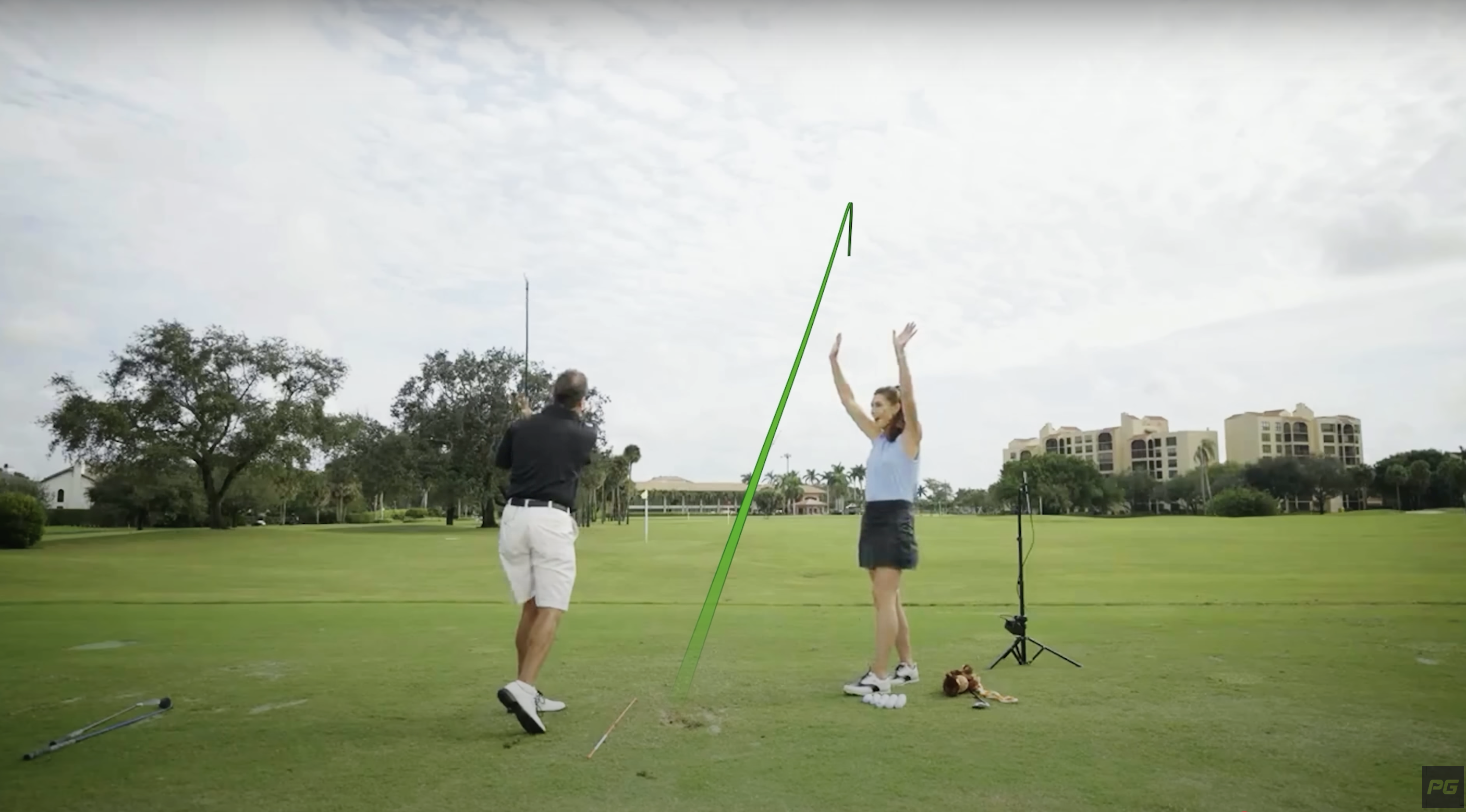 Performance Golf Coach Erika Larkin celebrating her golf student’s successful swing and golf contact.